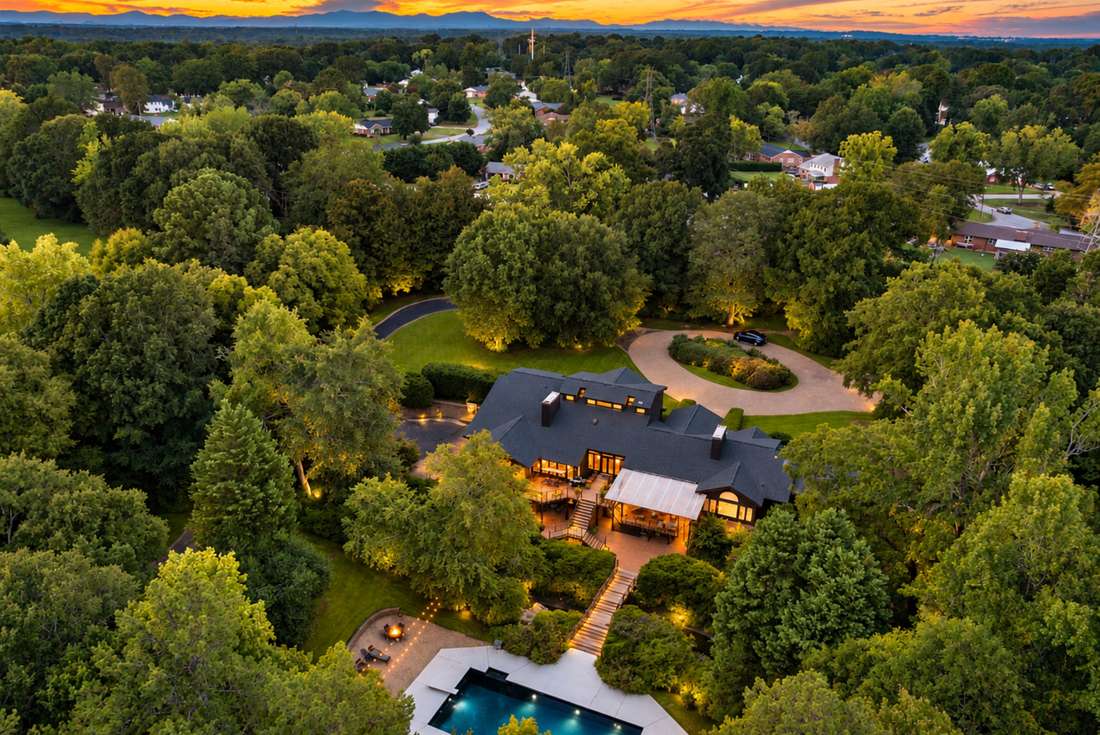 The property from above, pool below the roofline