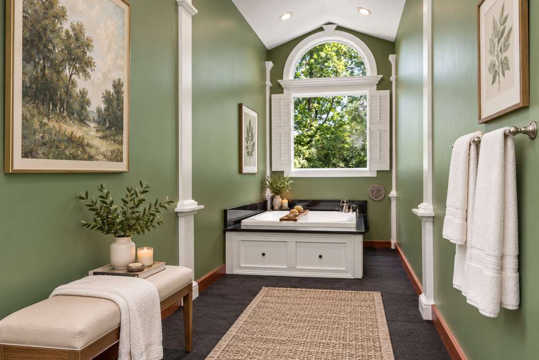 Primary bath, tub under the Palladian window